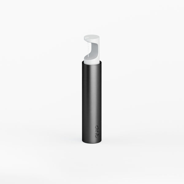 Quip's expanding floss string dispenser in color black, loaded with floss.